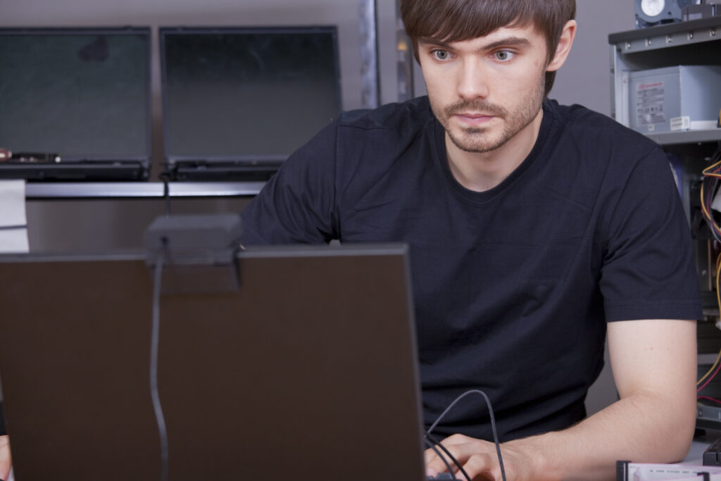 A young man learning online.